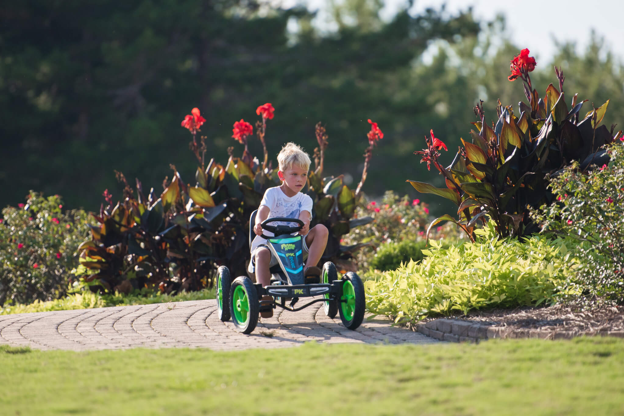 Kid riding a pedal kart