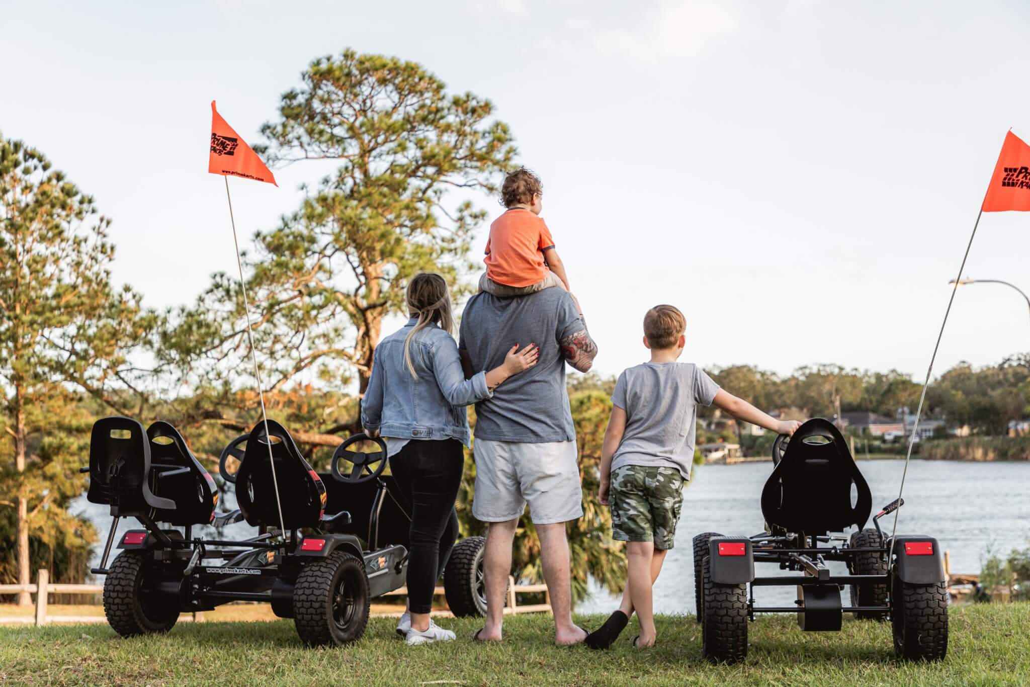 Family standing next to some Prime Karts